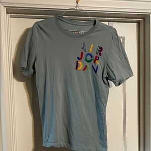 Air Jordan Light Blue T-Shirt with Colorful Logo - Perfect Condition